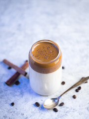 Wall Mural - Dalgona coffee. Iced fluffy creamy whipped trend drink with coffee foam and milk. trendy summer cold drink