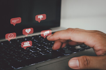 Poster - Hand pressing the keyboard of a laptop computer. Icon virtual interface technology concept. Social networks bully Gossips, quarrels, and fake news of a divided society.