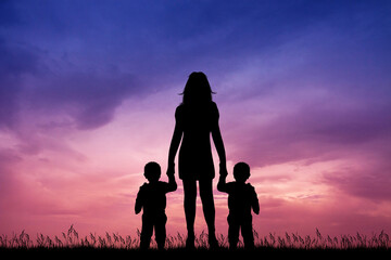 Canvas Print - mom with twins at sunset