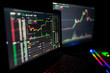 © Mihail Mihailov/Wirestock - Closeup shot of two monitors showing a crypto trader using the Binance trading platform