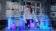 © Iokanan Pro - Professional Female Architect wearing Augmented Reality Headset makes gestures and redesigns 3D City Model. High Tech Office use Virtual Reality Holographic Modeling Software Application.