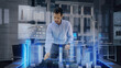 © Iokanan Pro - Professional Architect works with Holographic Augmented Reality 3D City Model using gestures. Technologically Advanced Office use Augmented Virtual Modeling Software Application on Futuristic Display.