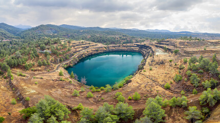 Wall Mural - Panorama of old copper mining area with lake and mine tailings near Kapedes, Cyprus