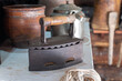 © delobol - Antique iron in a country house, shallow depth of field.