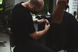 © Taras Grebinets - Hairdresser cutting woman's hair in beauty salon.