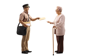 Young postman in a uniform delivering a letter to an elderly lady