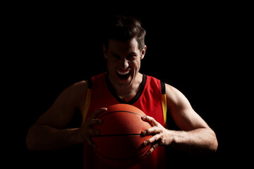 Sticker - Basketball player with ball on black background