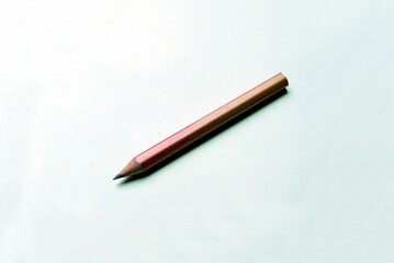 Wall Mural - Closeup shot of a pencil on white background