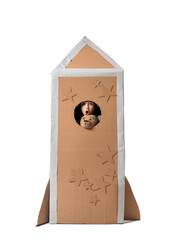 Poster - shocked little boy in cardboard rocket on white background