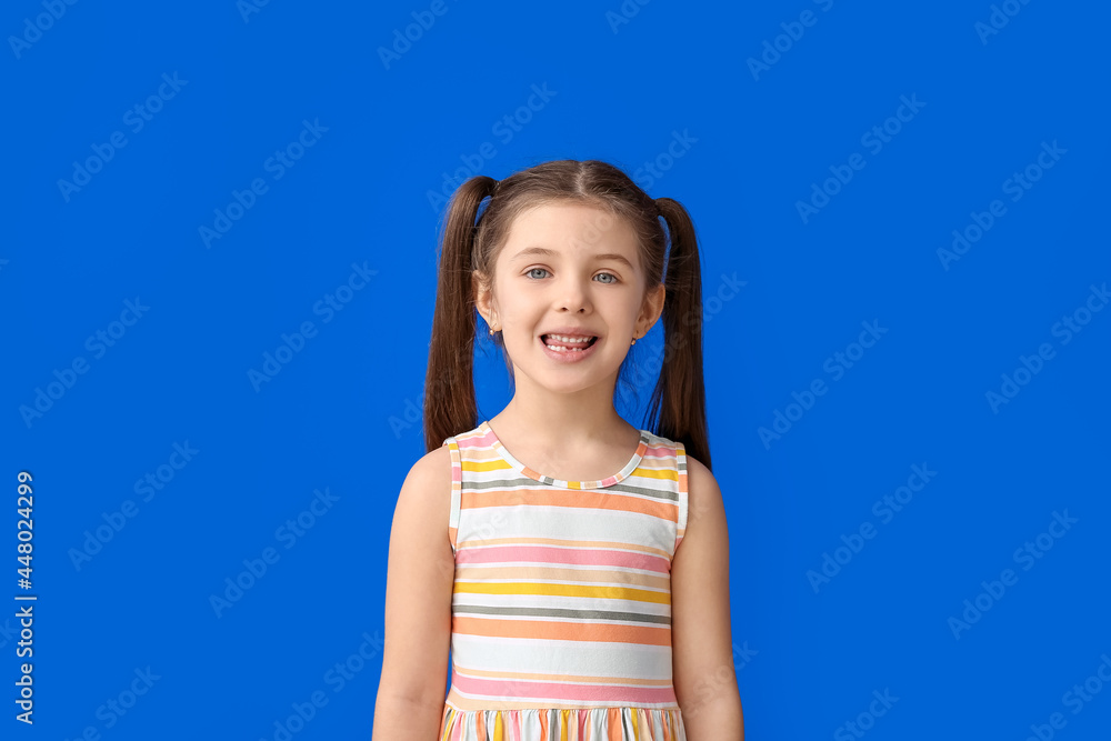 Little girl training pronounce letters on color background