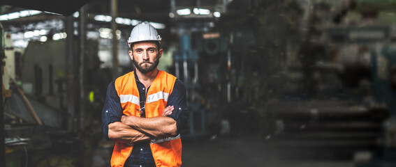 Man at work. Mechanical Engineer  man in Hard Hat Wearing Safety Jacket working in Heavy Industry Manufacturing Facility. Professional Engineer Operating lathe Machinery