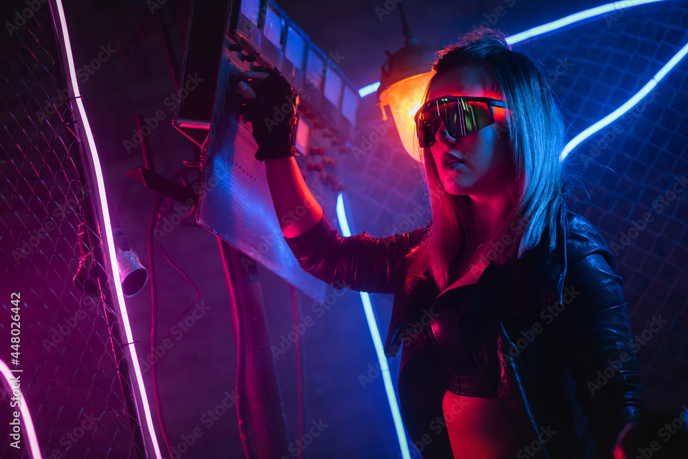 Cyberpunk girl in the neon lights. Stock Photo | Adobe Stock