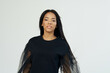 © SHOTPRIME STUDIO - pretty woman of african appearance in dark shirt fashion luxury cosmetics
