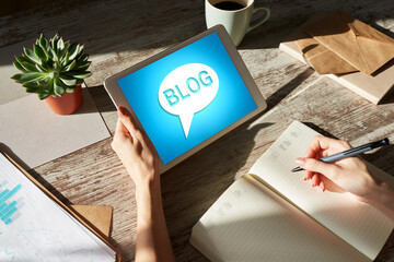 Wall Mural - tablet with blog text the on screen. social network, communication and internet marketing concept.