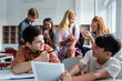 © LIGHTFIELD STUDIOS - Cheerful asian child holding digital tablet near friend and classmates