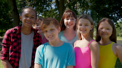 Portrait of multi-cultural children hanging out in countryside together