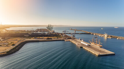 Canvas Print - Aerial. The maritime dock in the Portuguese city of Sines and the sailboat is moored for tourist excursions. Sunny day