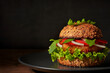 Tasty and healthy vegetarian burger with lentil's cutlet and fryed bun.