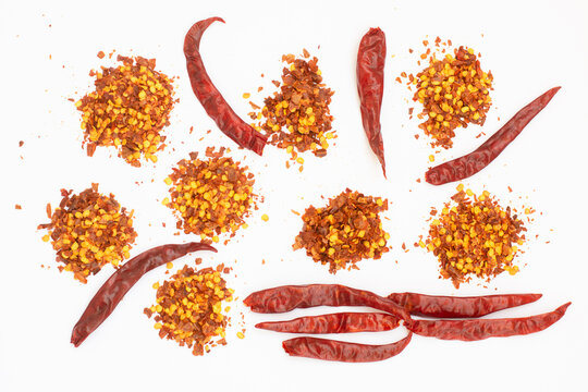 dried red pepper flakes isolated on white, top view
