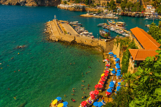 ANTALYA, TURKEY: Mermerli beach with clear blue water in old town Kaleici district in popular seaside resort Antalya.