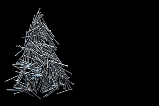  christmas tree folded of construction nails isolated on black background.
