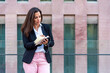 © Viviland - Caucasian business woman with notebook in the city