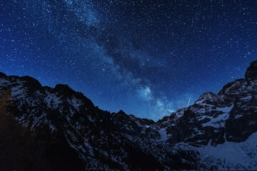 Wall Mural - bright starry sky with the milky way on the background of high tatras mountains