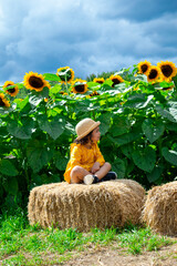 Beautiful girl in a field of sunflowers