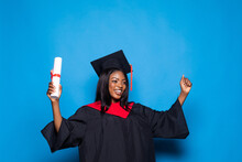 Pretty African American Woman Graduate Isolated On Blue Background