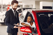 © prostooleh - Stylish black woman in a car salon