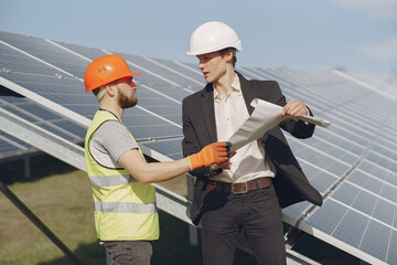 Wall Mural - Foreman and businessman at solar energy station.