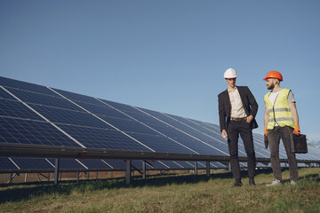 Wall Mural - Foreman and businessman at solar energy station.