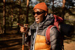 © Anatoliy Karlyuk - Funny black man in good mood pointing with finger, hand gesture. Cheerful guy in sportswear ready for camping, hiking and active pastime. Wildlife, travel alone, explore peaceful places concept