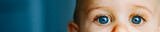 Fototapeta  - Baby boy face with blue eyes, close-up.