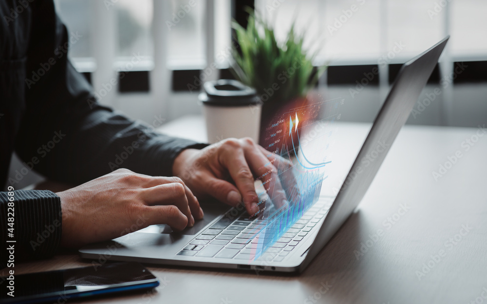 Close up of Business man work in office with laptop. Concept of analysis,growth, Market research reports and income statistics, Financial and Accounting ,double exposure with network effects.