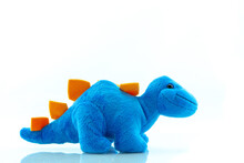 Blue Dinosaur Plush Toy Isolated On White. This Dinosaur Doll Also Called Stegosaurus