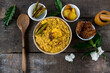 Dal khichadi or khichdi a delicious Indian recipe made of yellow dal or lentils and rice . Selective focus. It is generally accompanied with fried vegetables. Top view.