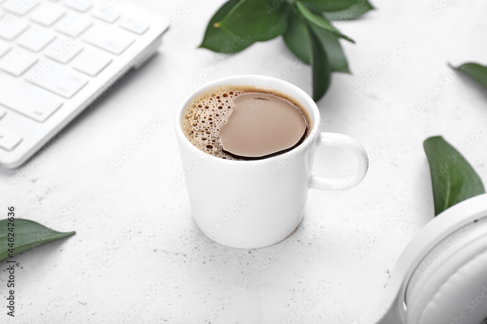 Cup of coffee on light background