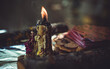 Candle burns on the altar, magic among candles, clean negative energy, wicca concept