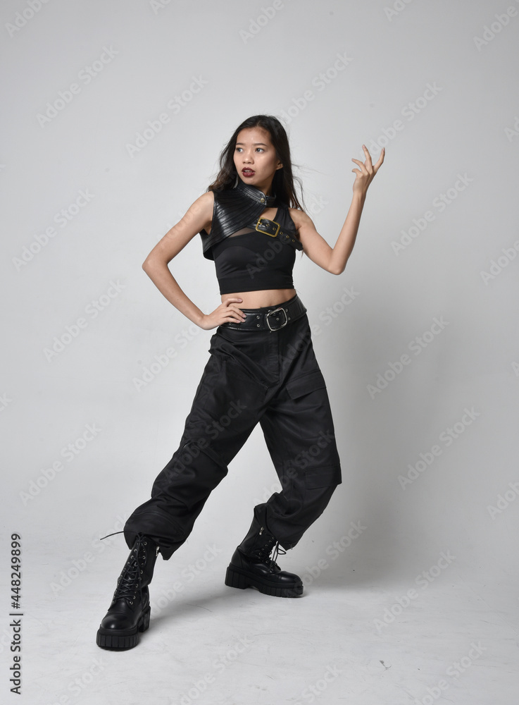 Full length portrait of pretty young asian girl wearing black tank top ...