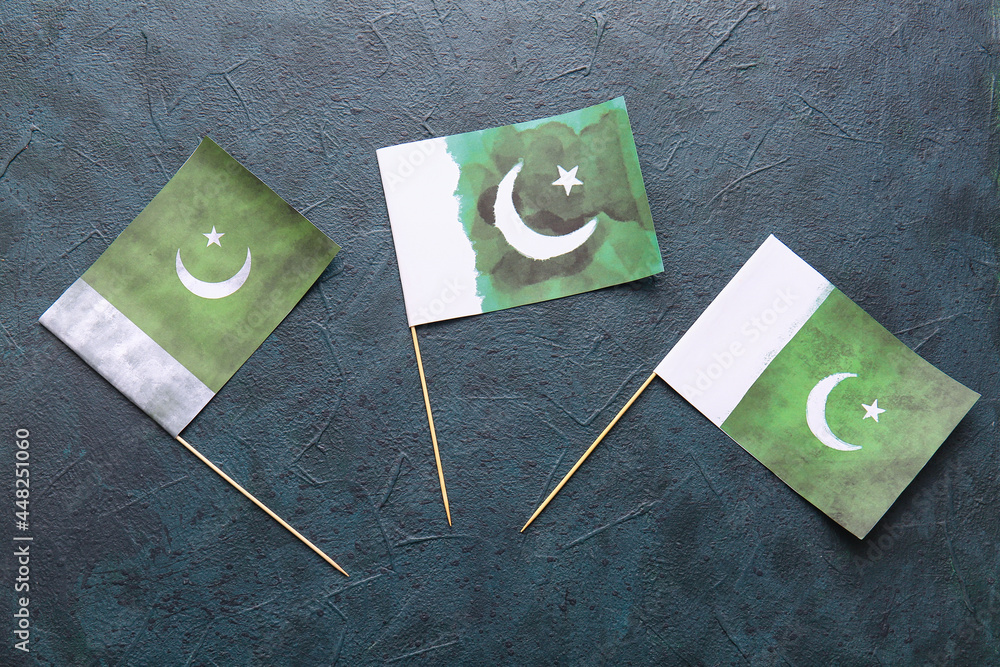 Pakistan flags on dark background