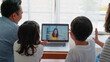 © Urbanscape - Young happy Asian family online video call with friend or relative cousin, using laptop computer at home. Internet information technology, social distancing or coronavirus new normal lifestyle concept
