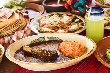 Wall Mural - Mole poblano with chicken and red rice and lemonade in Mexico City