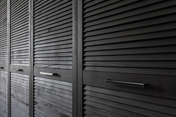 Wall Mural - Close-up of a textured wooden black cabinet.