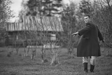 Vintage Man Young Village Black And White, Eastern Europe Style, Retro Coat And Boots