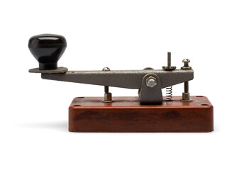 Telegraph key or Morse key isolated on white background. Vintage Morse code telegraphy device side view.