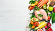 Healthy food background. Fresh vegetables, fruits and chicken meat. Free space for your text. Rustic style.