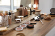 © New Africa - Many different cosmetic products on dressing table indoors