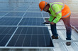 © ENGINEER - STUDIO - worker with Solar panels. Installation solar roof.
