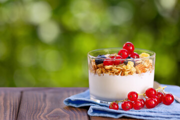 Canvas Print - granola with greek yogurt and berries in glass